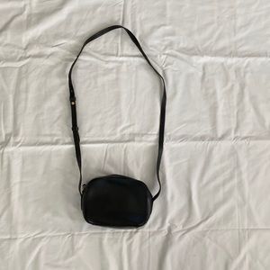 JCrew black leather purse with adjustable strap.
